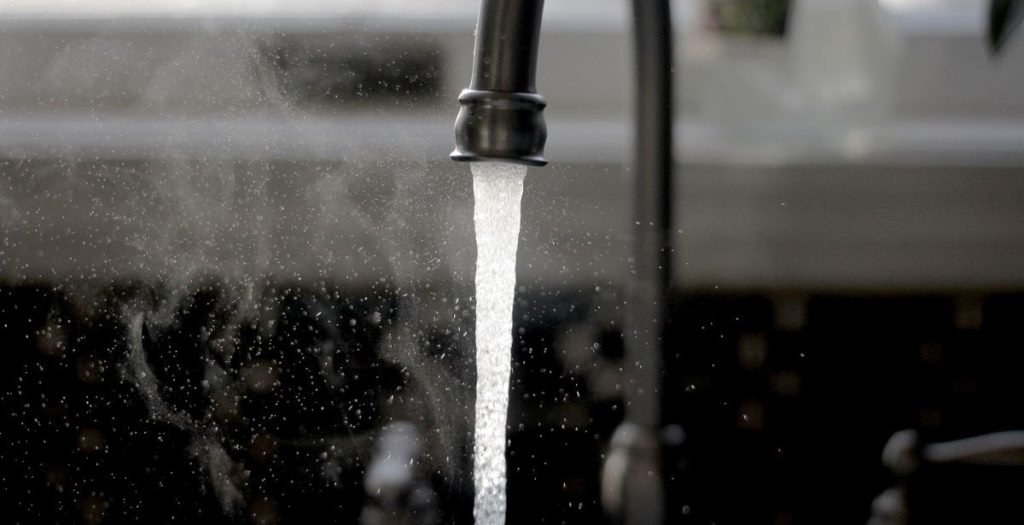 Water coming out of a faucet