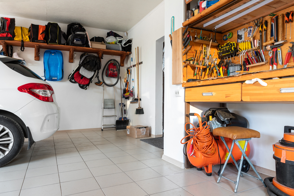 A garage with a car and other items in it.